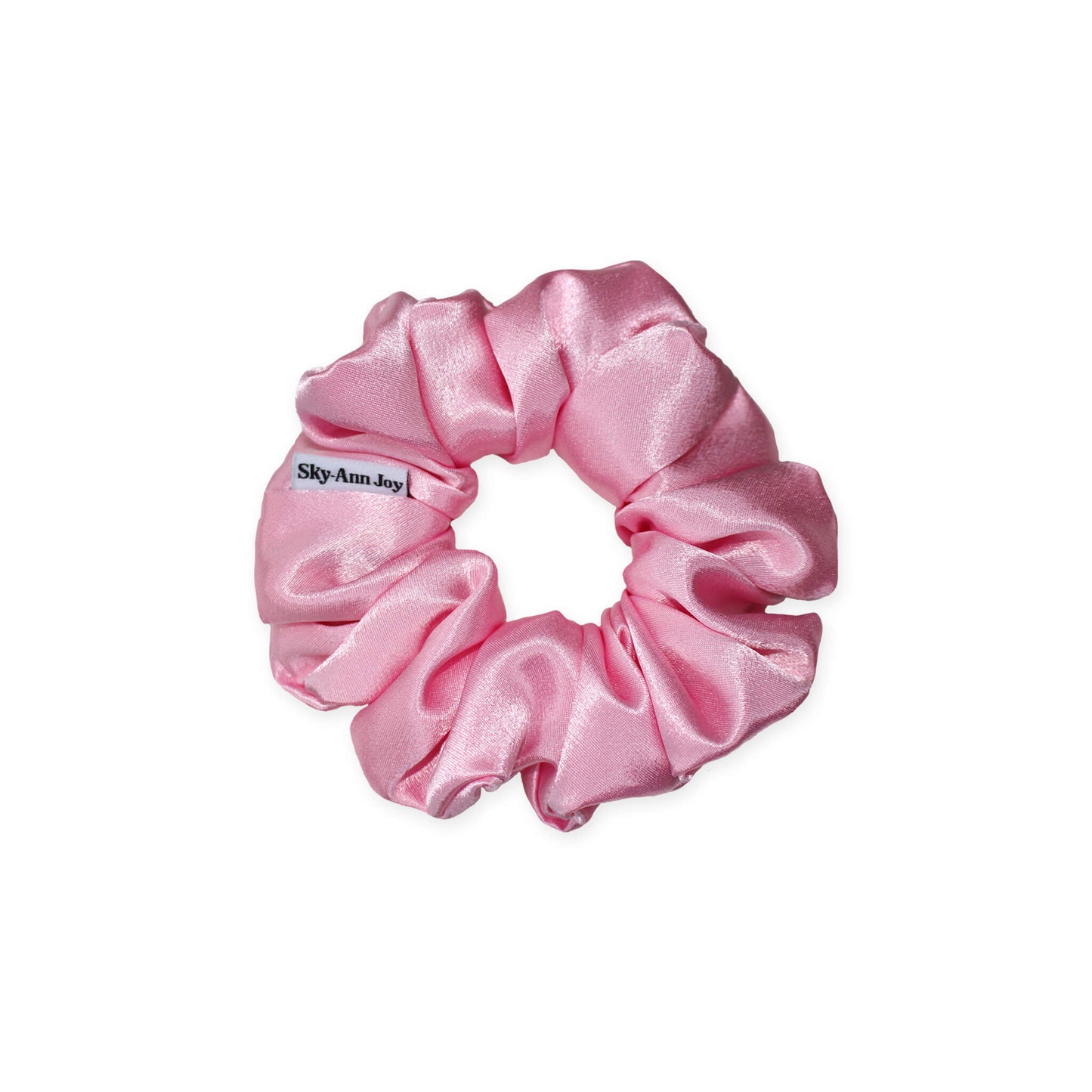 Pink satin hair scrunchie made from polyester fabric, luxurious and shiny, perfect for adding a touch of elegance to formal outfits