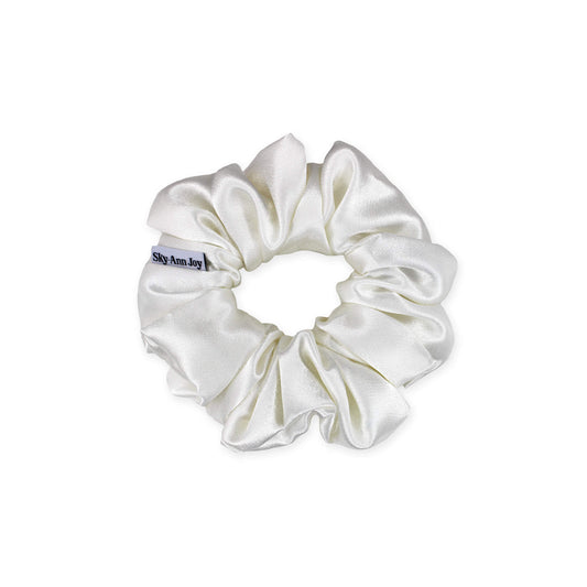 Ivory satin hair scrunchie made from polyester fabric, smooth and shiny, perfect for adding a touch of elegance to formal outfits